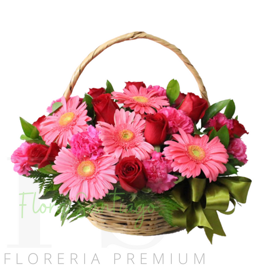 canasto de 12 rosas y 10 gerberas en tonos rosados